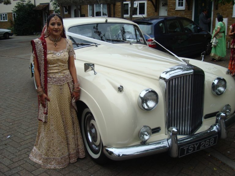Interior view of the Bentley S1, showcasing the driver's seat for chauffeur hire