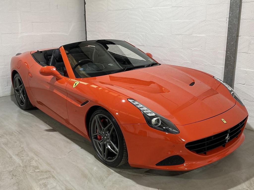 Red Ferrari California parked and ready for hire