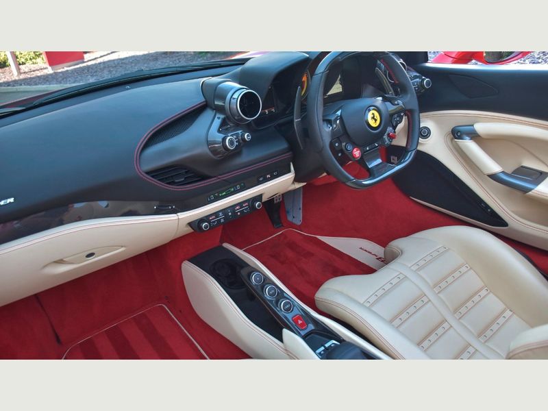 Chauffeur preparing a Ferrari F8 Spider for hiring