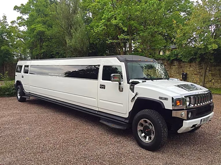 A striking white Hummer H2 stretch limousine available for hire in Sutton.