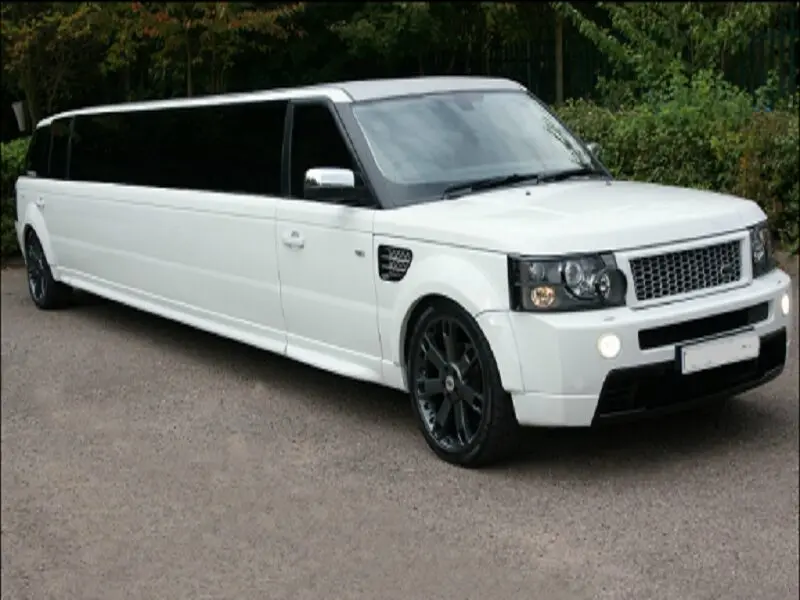 Chauffeur opening the door of a Range Rover Limousine in St Albans