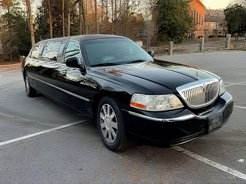 A classic white Lincoln Town Car stretch limousine ready for hire in Sutton.
